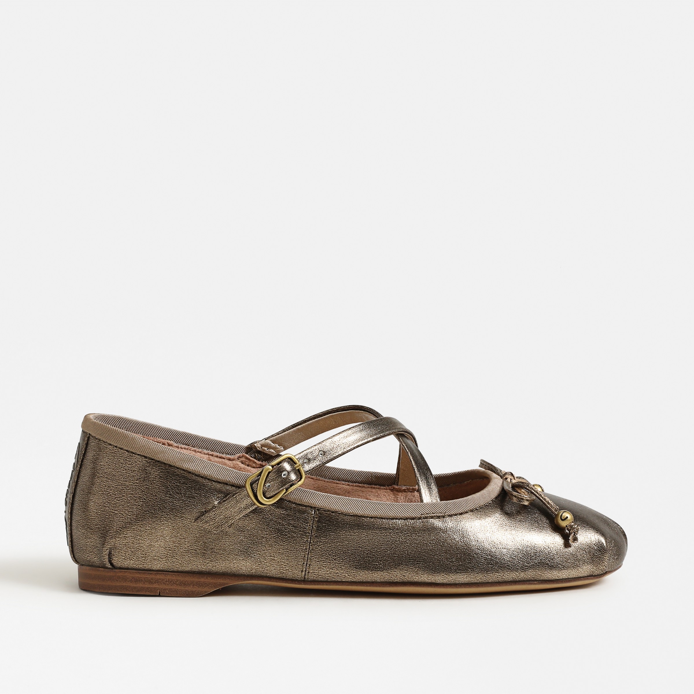 flats featuring the zuri in gilded bronze