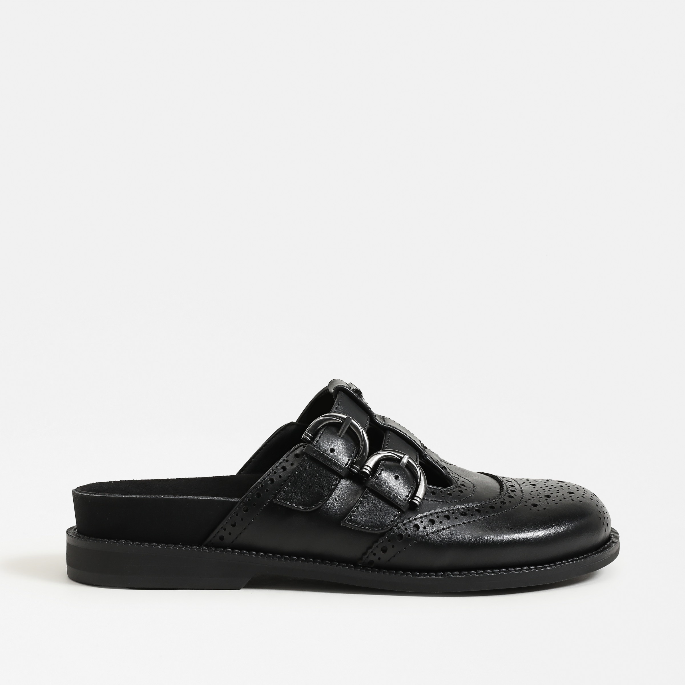 mules featuring the claudia clog in black