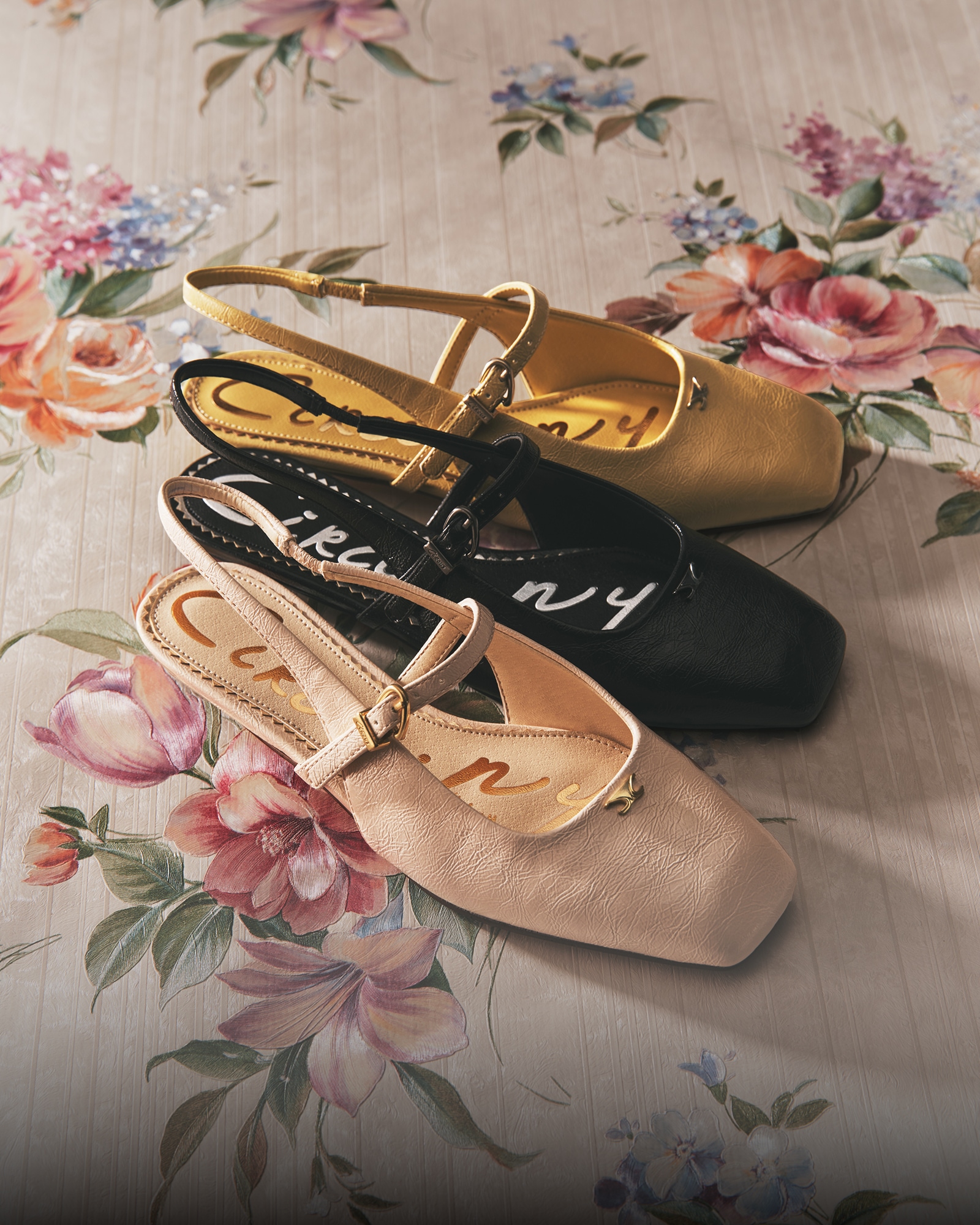 the elara slingback flat in vanilla bean, dust yellow, and black