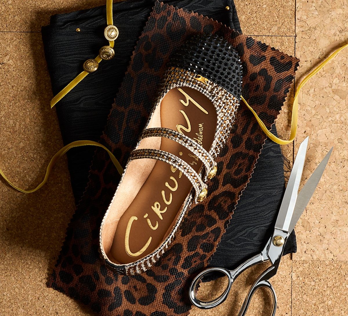 The Zoey Cap Toe Mary Jane with all-over crystals and a contrast cap toe on a designer workboard.