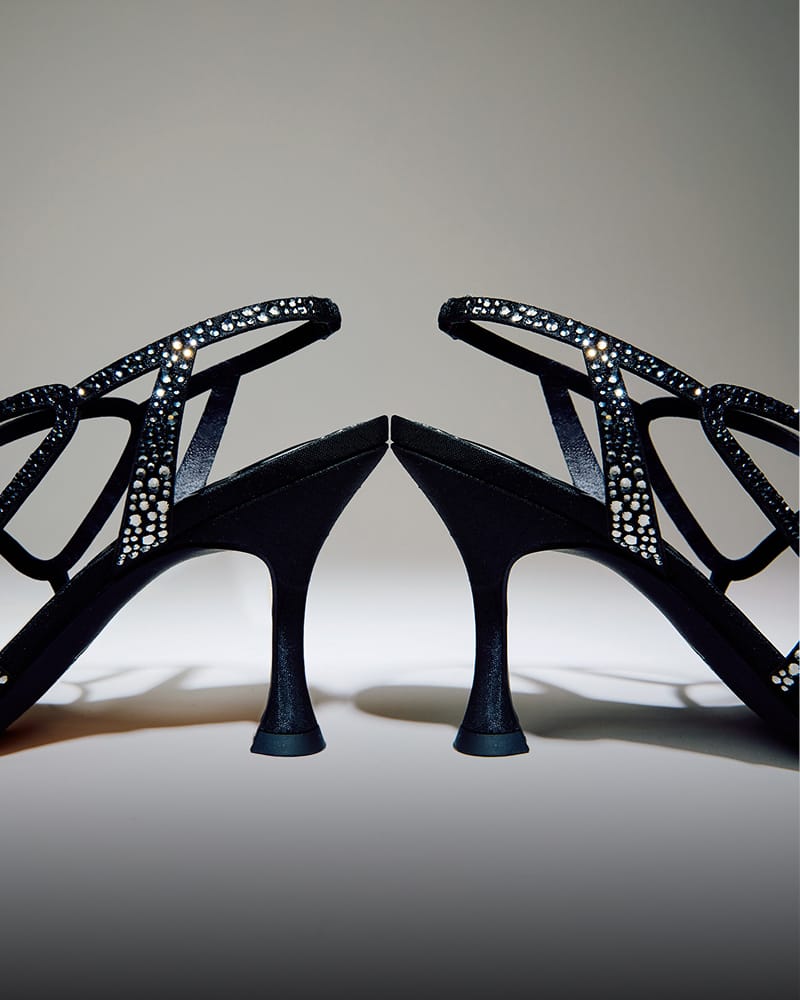 Circus NY Louisa Strappy Heel Sandal in black, showcasing the sculptural architectural heel